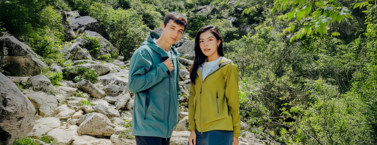 Man and woman wearing PORLITE mountaineering jackets in outdoor scene