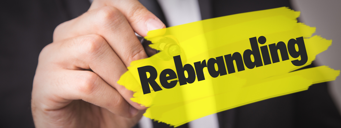 Hand highlighting the word rebranding