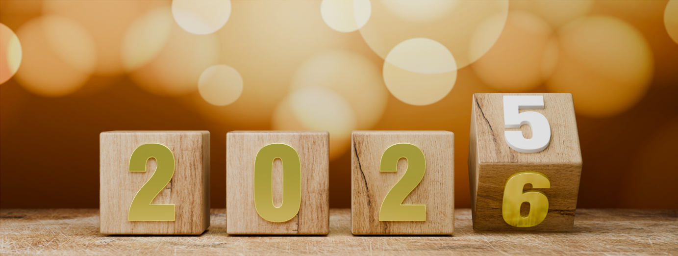 Wooden blocks showing the transition from 2025 to 2026